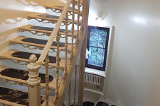Iron staircase with inserts made of natural stone